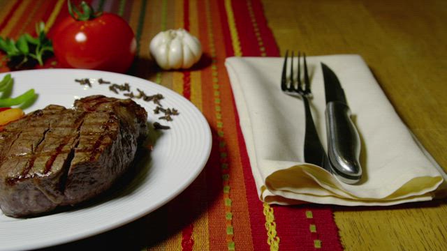 Thick steak with vegetables.