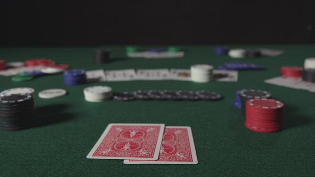 Checking cards during a Poker game.