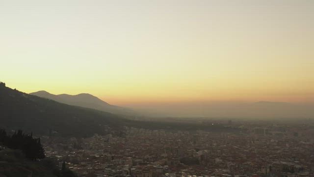 Early morning mist across a city.