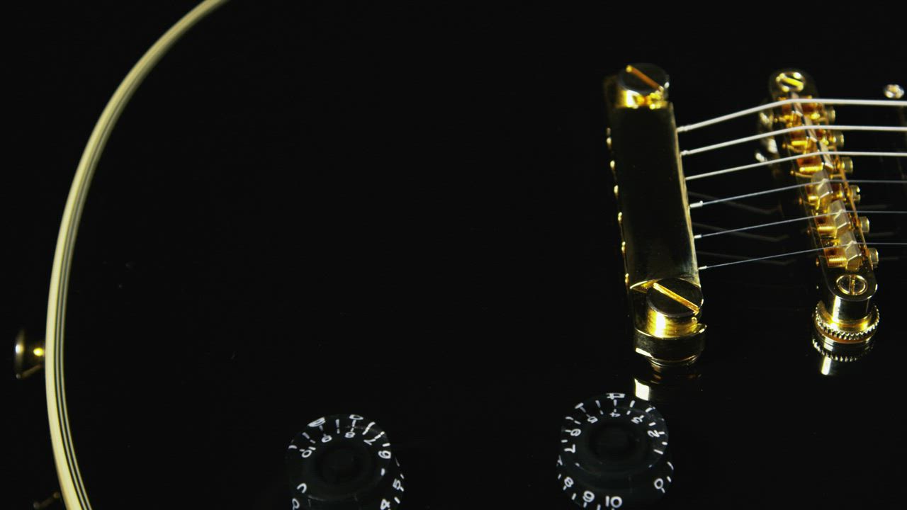 Black guitar with golden strings - Free Stock Video