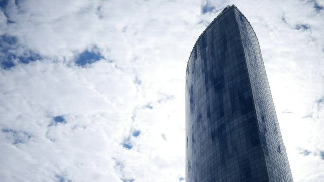 Skyscraper and a cloudy sky.