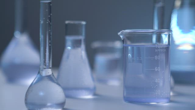 Chemical flasks on a table.