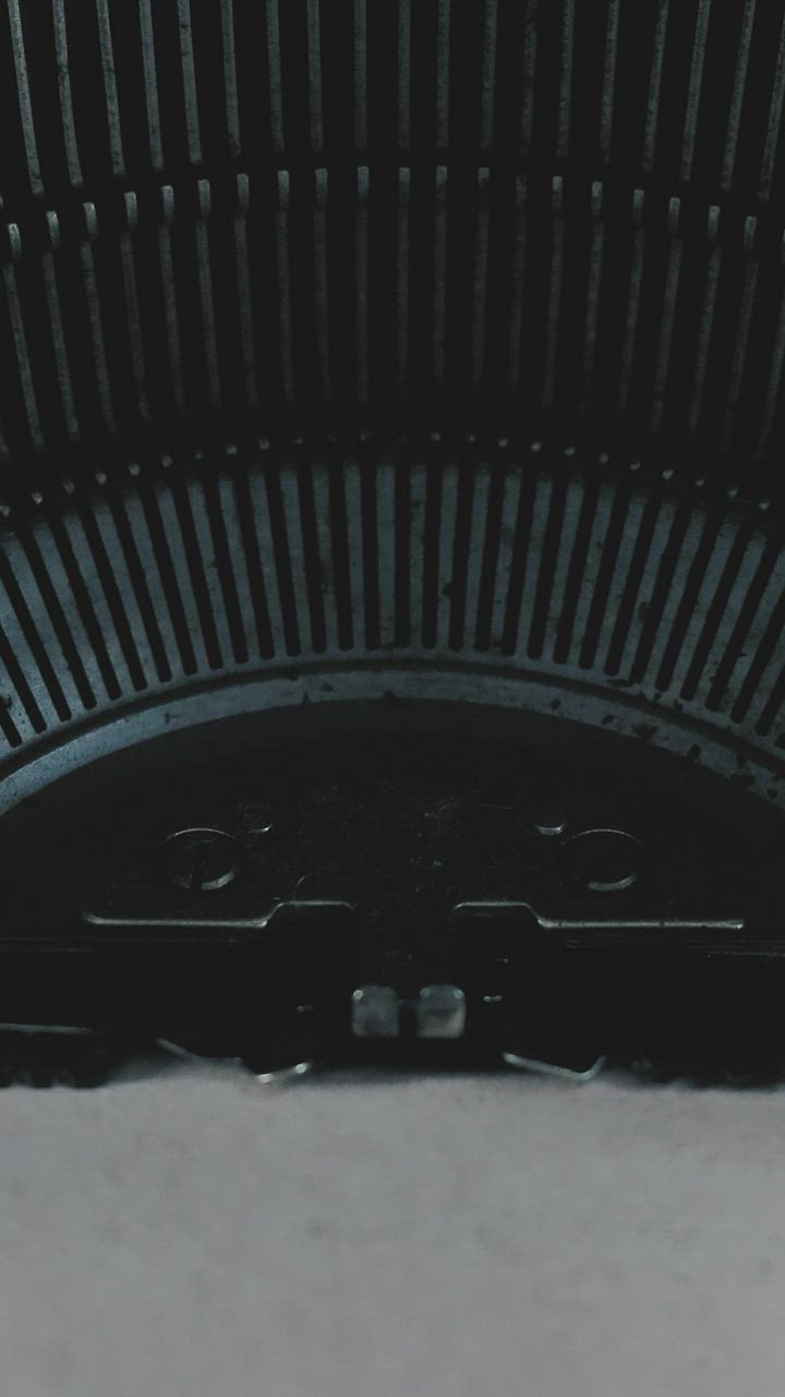 Typewriter in a close shot when writing on the sheet - Free Stock Video