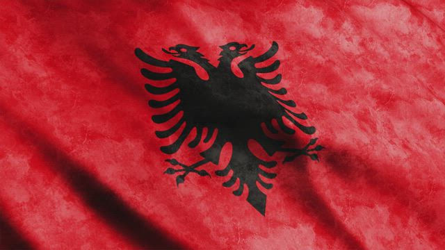 Red Albania flag waving.