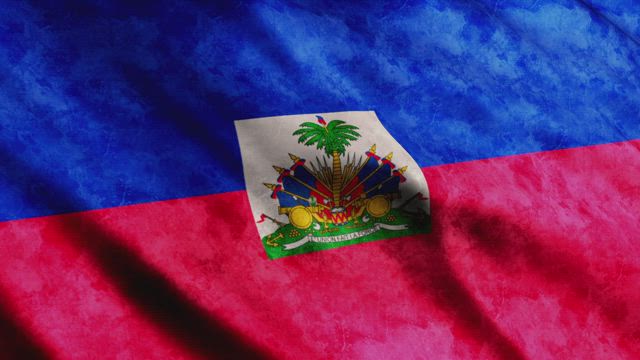 The Haiti flag waving in close up.