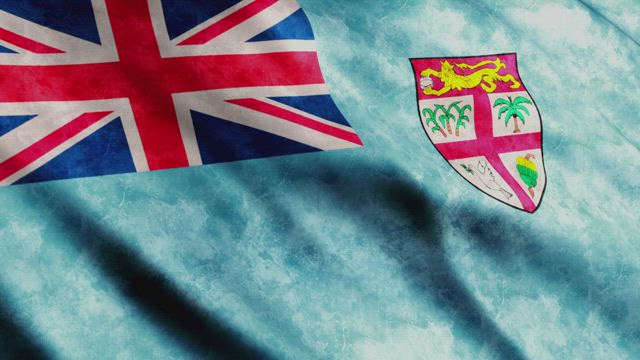 Fiji faded flag waving.