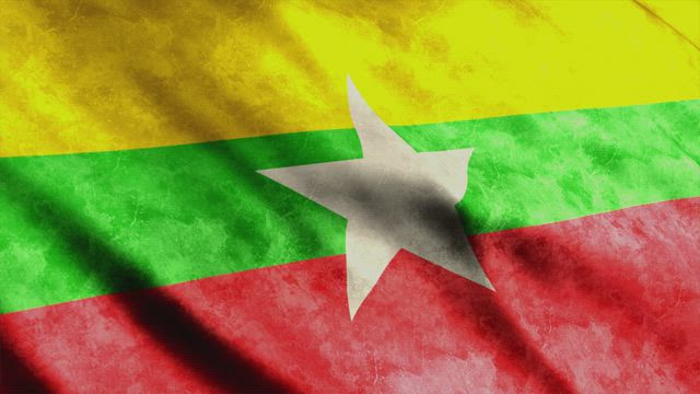 Myanmar faded waving flag.