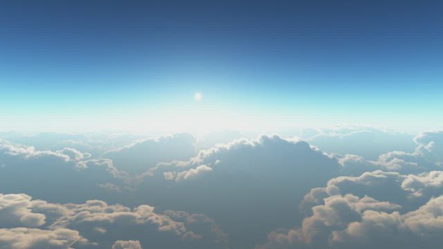 Flying above the clouds on a sunny day.