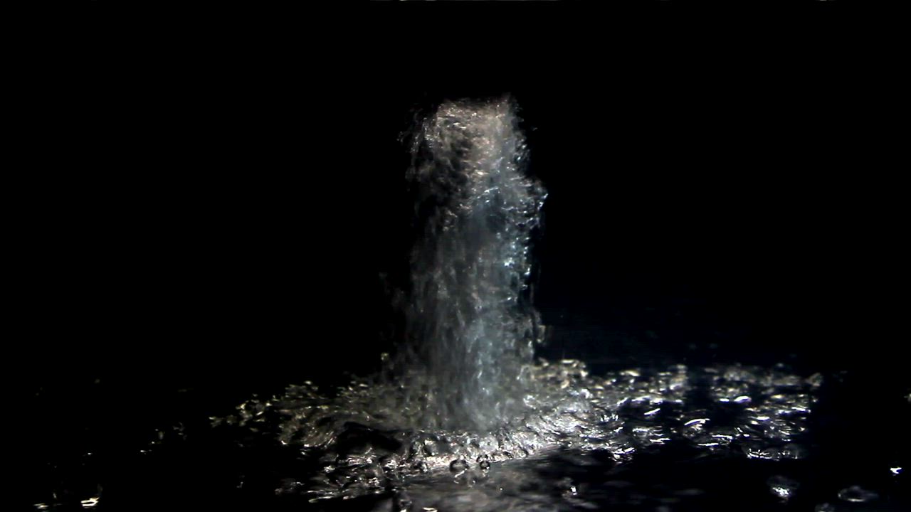 Water stream breaking the surface - Free Stock Video