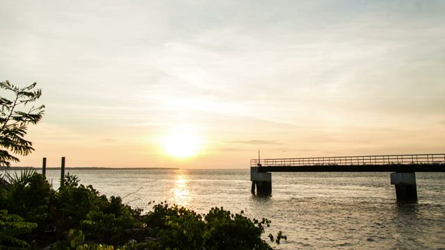 Silhouette of the coast at sundown.