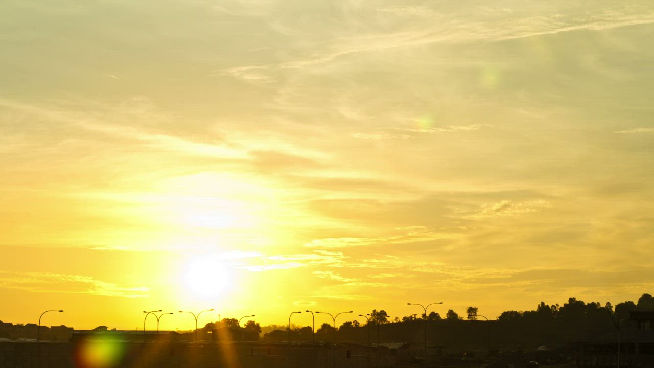 Yellow sky as the Sun sets - Free Stock Video