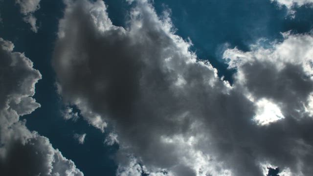 Rich blue sky behind white clouds.
