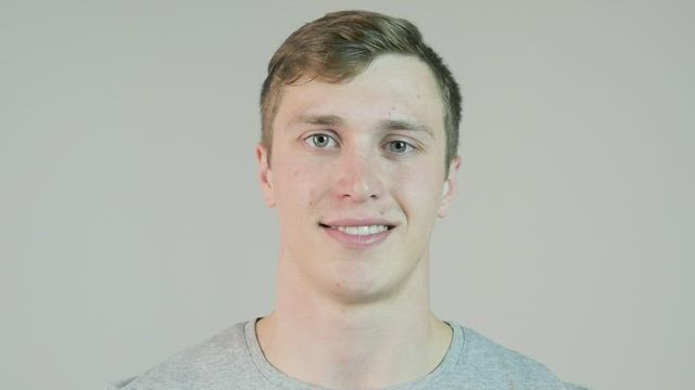 Man winking against an isolated background.