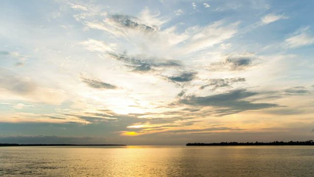 Boat racing the sunset.