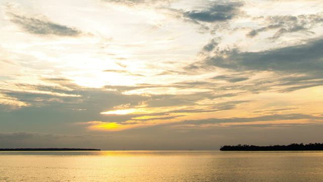 Orange sunset beyond the horizon.