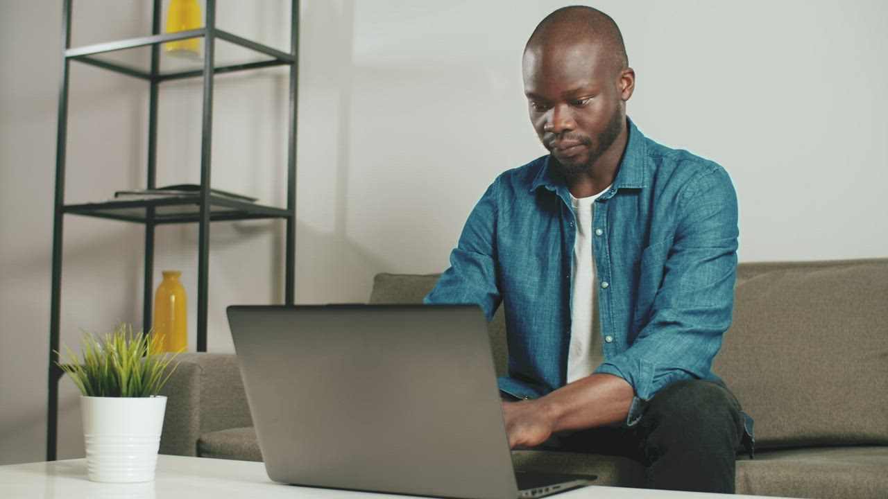 Man working on his laptop remotely - Free Stock Video