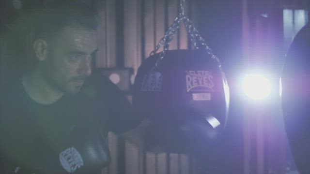 Man training with a punch bag .