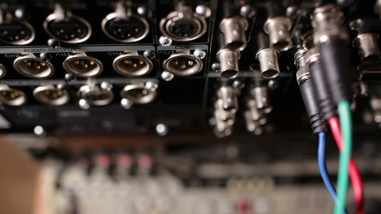 Plugging in cables to a recorder - Free Stock Video