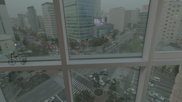 Standing by the window in Korea.