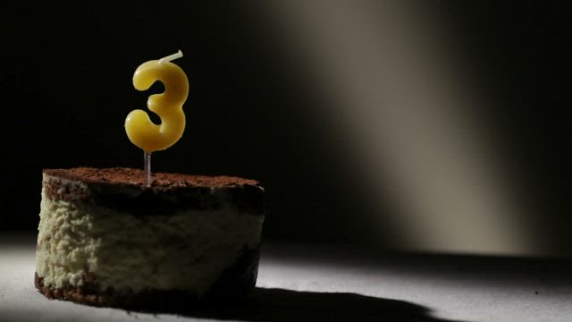 Birthday candle on a cake.