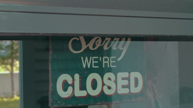 Switching a cafe sign to open.