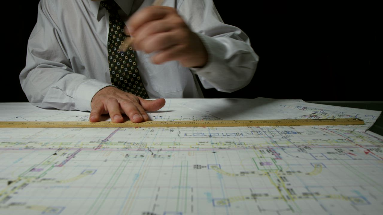 Architect drafting up plans - Free Stock Video