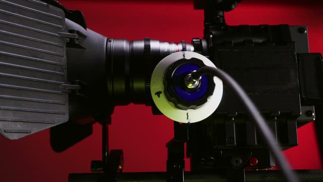 Red Camera against a red background.