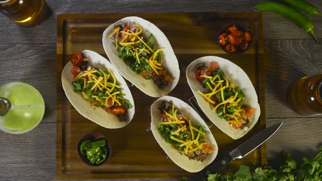 Tacos with meat and cheese.