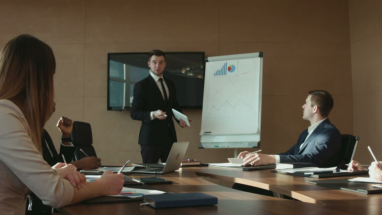 A man is presenting a business report - Free Stock Video