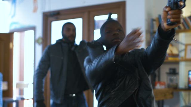 Thieves robbing a shop.