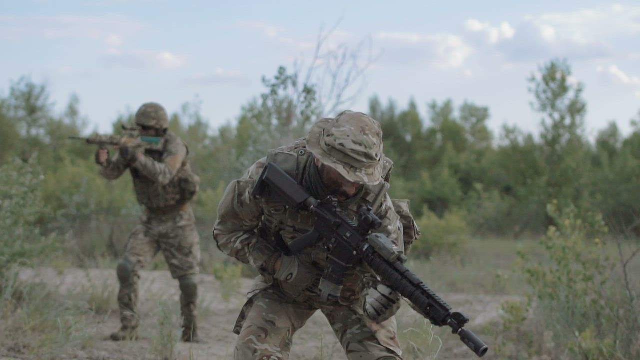 Wounded soldier rescued by a battle partner - Free Stock Video