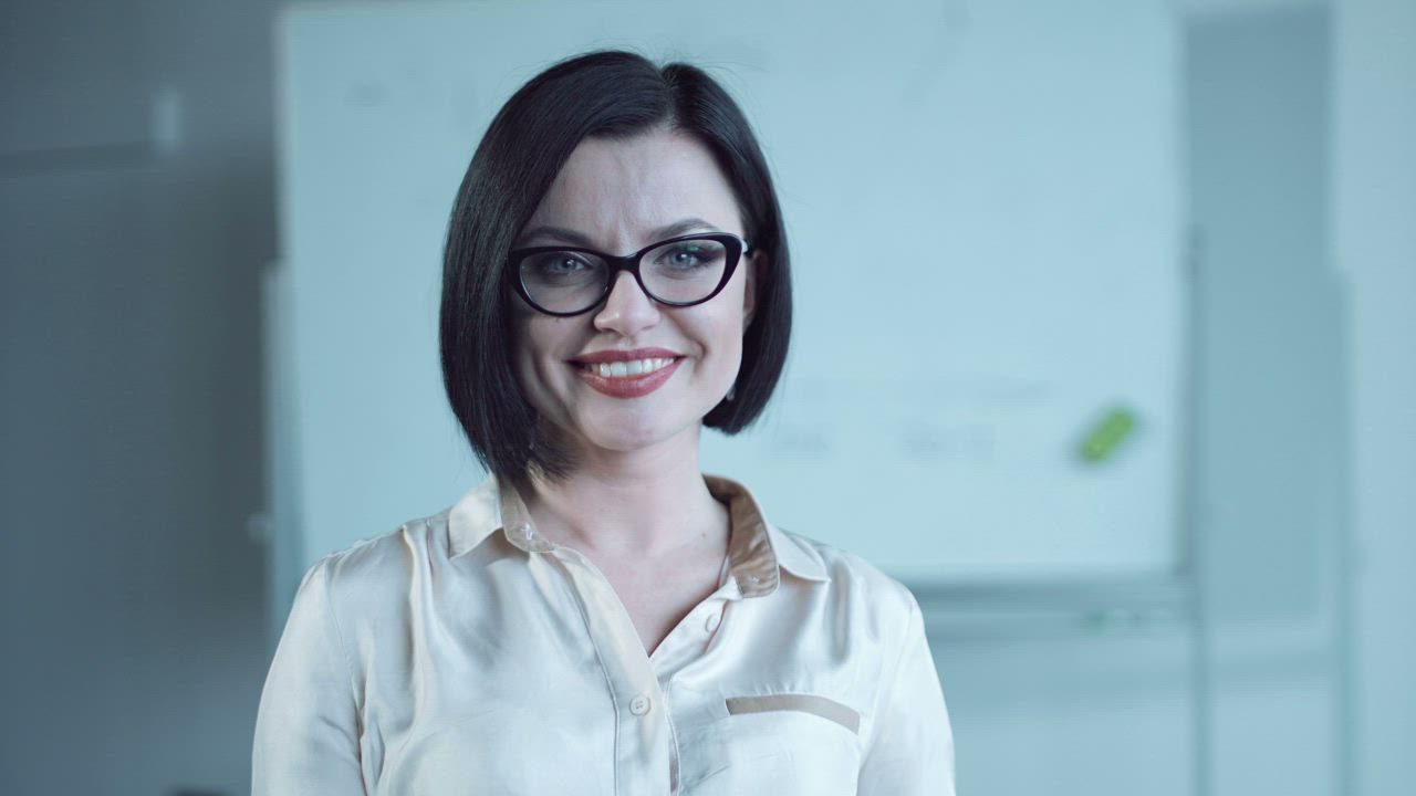 Business woman smiling and looking at the camera - Free Stock Video