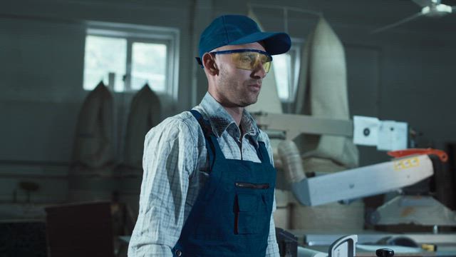 Worker putting on headphones.