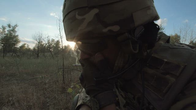 Soldier smoking on the countryside.