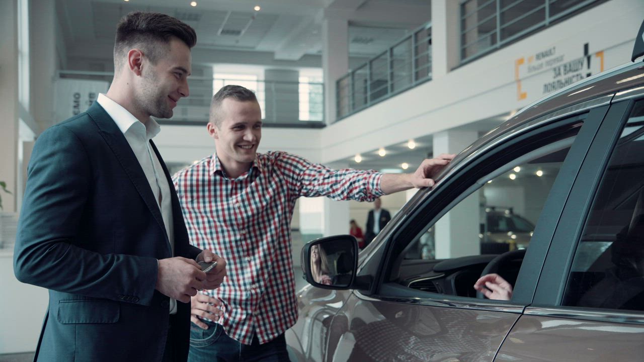 Giving the key to a new car owner - Free Stock Video