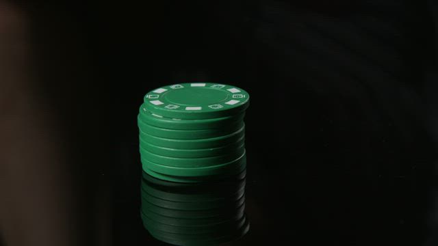 Holding green chips.
