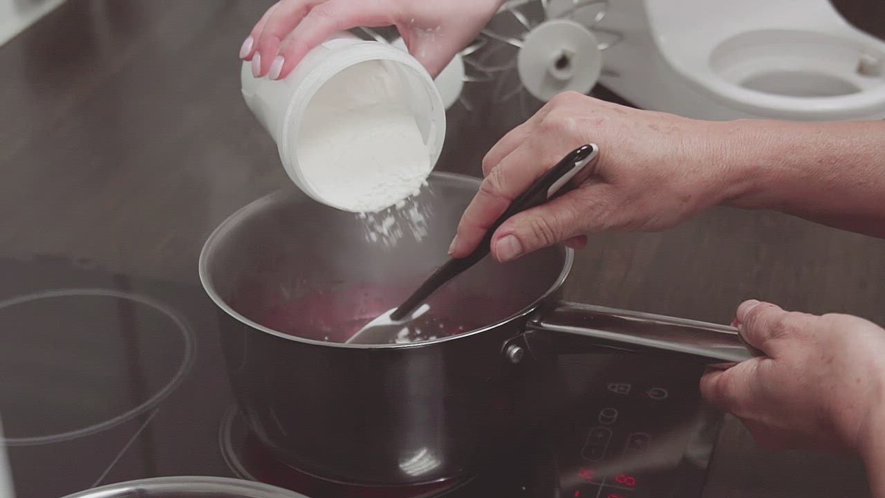 Pouring sugar into a pan - Free Stock Video