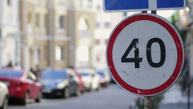 Speed limit sign in the street.