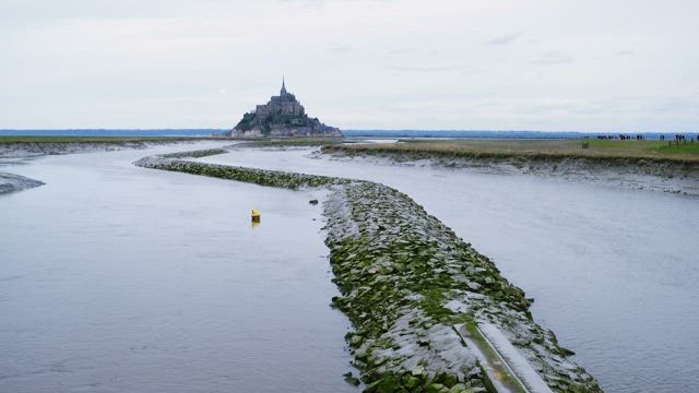 River landscape with a castle in the distance.