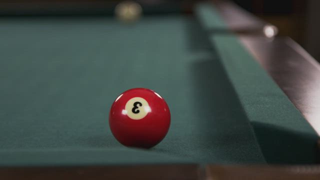 Red ball on a Pool Table.