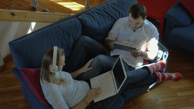 Couple working together at home.