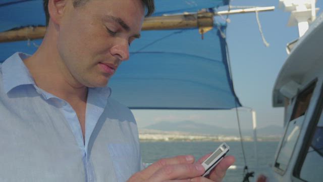 Using a smartphone on a boat.