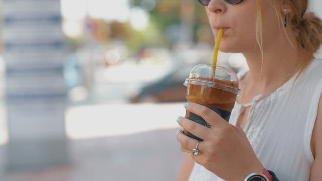 Drinking a cold coffee.