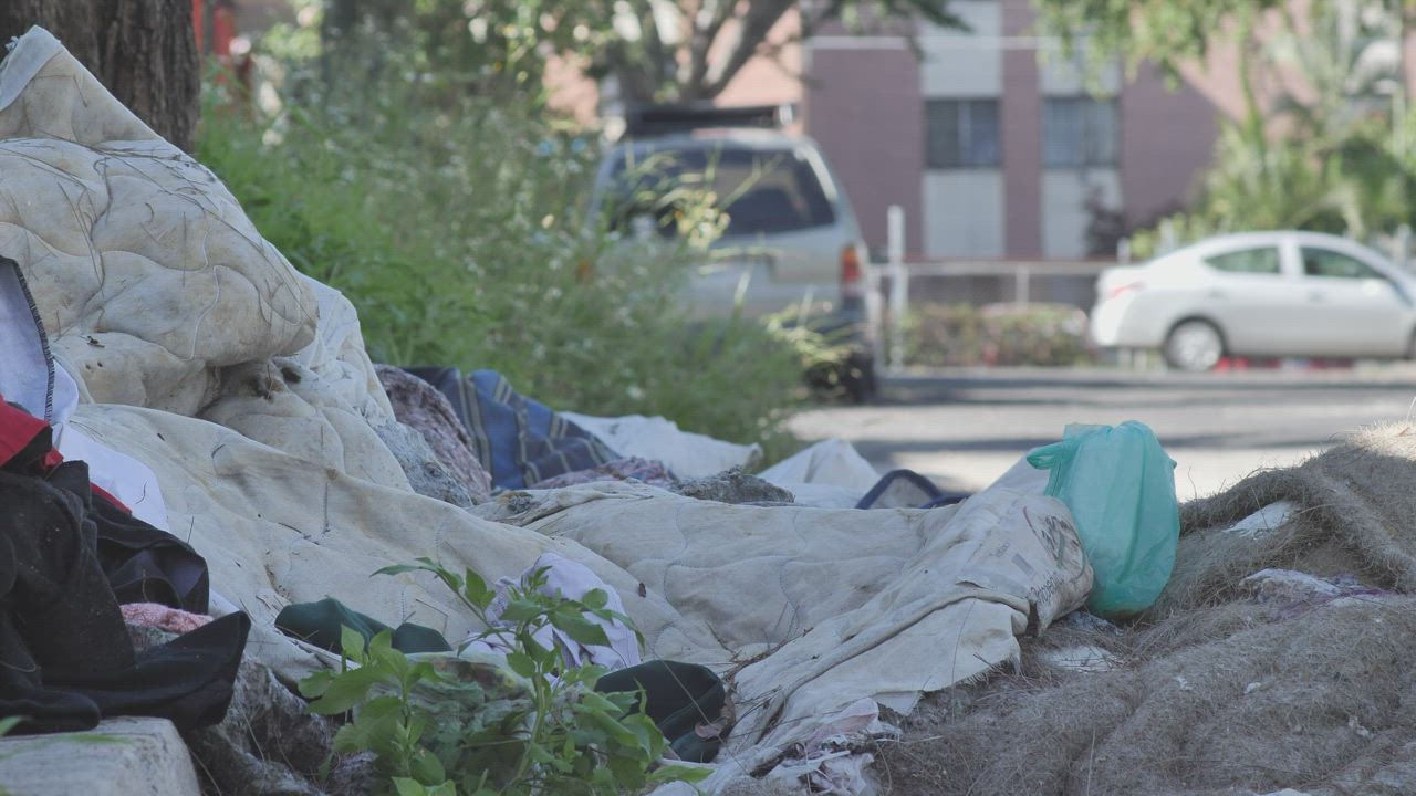 Dirty and damaged fabrics thrown in the street - Free Stock Video