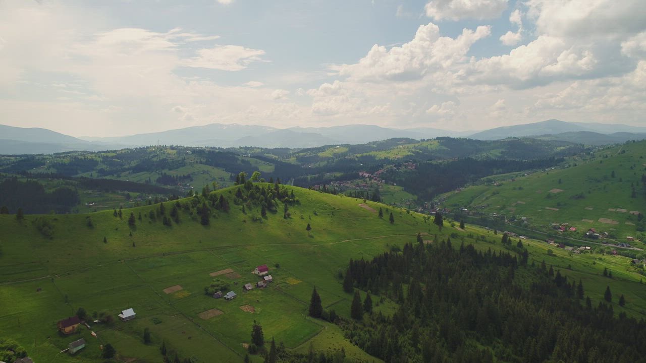 Aerial skyline view of a hill valley - Free Stock Video