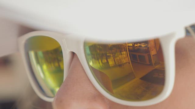 Woman wearing yellow glasses.