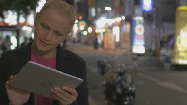 Woman using a tablet in Korea.