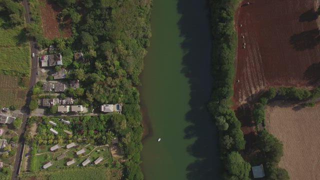River between farmland in Mauritius.