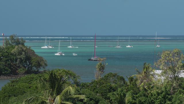 Yachts moving in the waves.