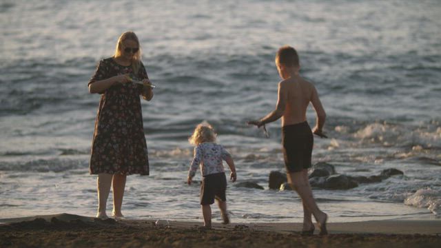 Mother playing with her two children.